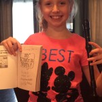 Emma and her signed copy of "Mr. Klutz is Nuts" by Dan Gutman