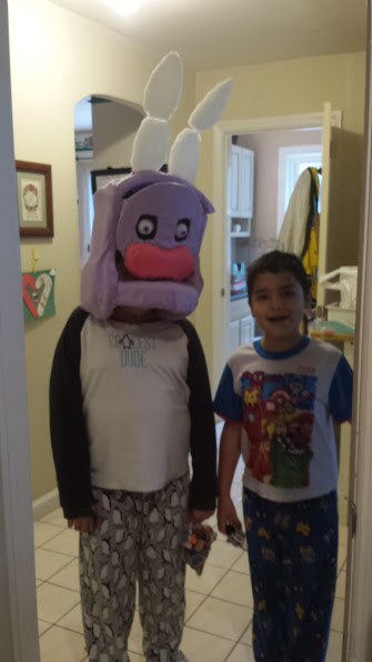 In process pic of my son wearing the withered Bonnie mask. Pink snout is a car sponge